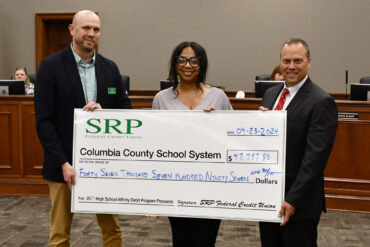 Affinity Debit Card Check Presentations Made to Local School Districts